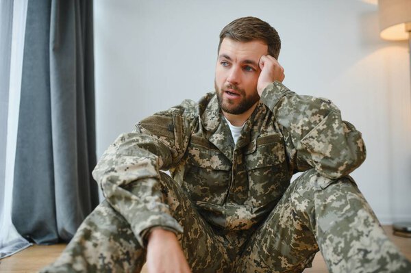 Crying professional soldier with depression and trauma after war.