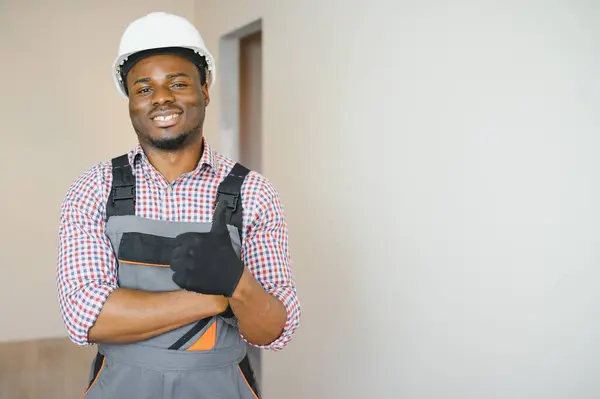portrait of an African American construction worker on location.