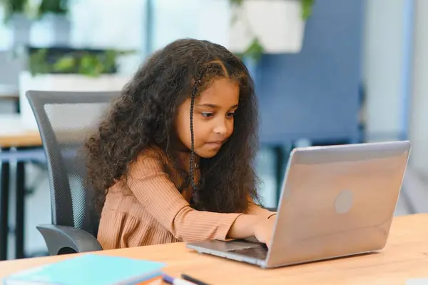 african american girl studying at laptop. online learning.