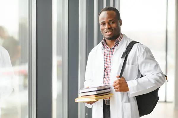 Portrait of a young african ethnicity physician or medical student in uniform.