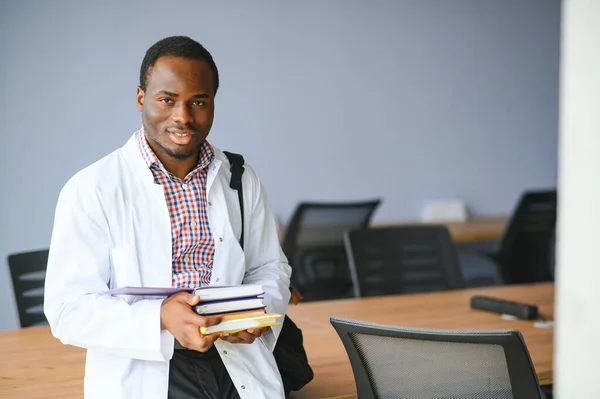 Portrait of a young african ethnicity physician or medical student in uniform.