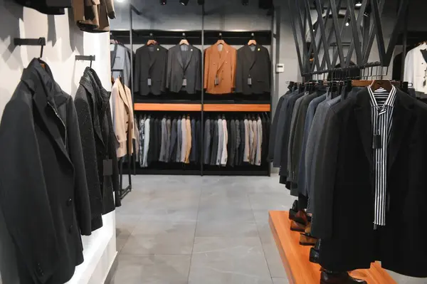 Modern luxury store with mens clothing inside shopping center.