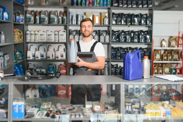 A salesman in an auto parts store. Retail trade of auto parts.