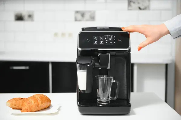 Modern coffee machine in kitchen,