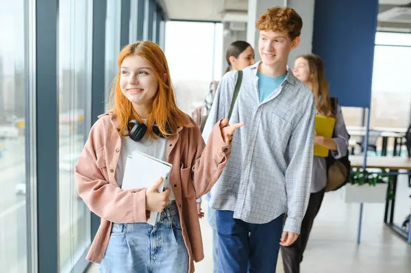 stock image group of college students walking to lecture hall.