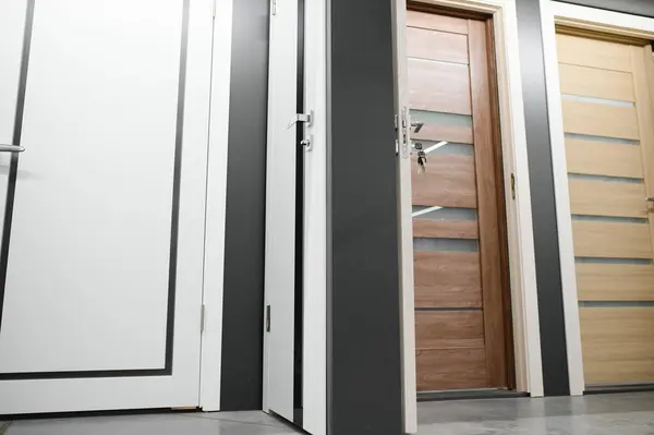 Doors are sold at a hardware store. Choosing doors for the house close-up. Interior renovation concept.