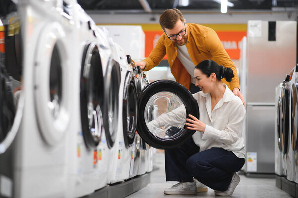 Couple Choosing Wasing Machine Electronics Store Royalty Free Stock Photos