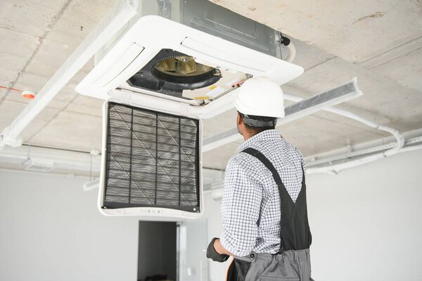 Electrician Technician Repairing Air Conditioner Appliance Stock Picture