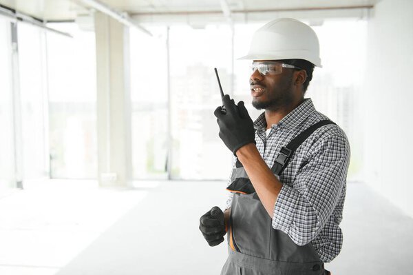 African Male Builder Talking His Radio Royalty Free Stock Photos
