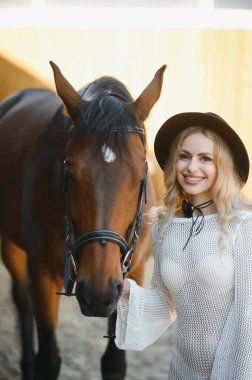 young woman in a dress with a horse.