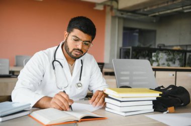 multiracial South Asian medical students with a medical court and stethoscope. medical student life. clipart