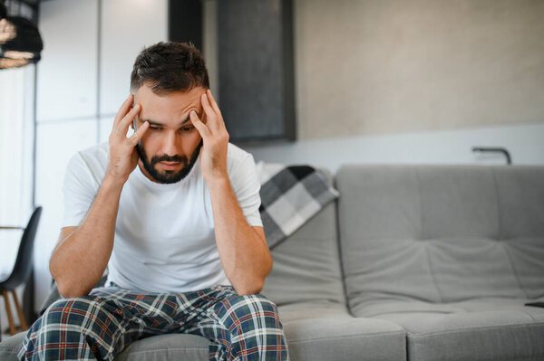 Morning of man suffering from headache.