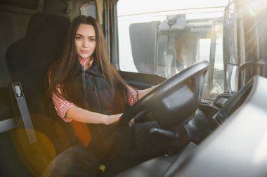 Genç bir kadının portresi. Profesyonel bir kamyon şoförü..