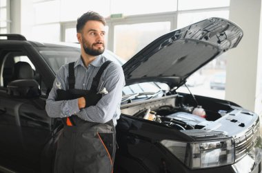 Troubleshooting process. Auto mechanic working in garage. Repair service. clipart