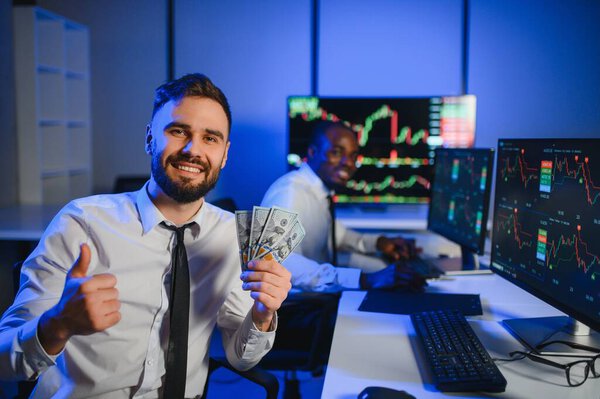 Holding Dollar bills in the stock market. Investor counting money after making it big on the stock market.