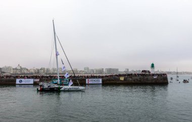 LES SABLES D'OLONNE, FRANCE - NOVEMBER 10, 2024: Giancarlo Pedote boat (Prysmian) in the channel for the start of the Vendee Globe 2024 on November 10,2024. in Les Sables d'Olonne, France. clipart