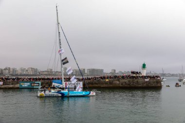 LES SABLES D'OLONNE, FRANCE - NOVEMBER 10, 2024: Sbastien Simon boat (Groupe Dubreuil) in the channel for the start of the Vendee Globe 2024 on November 10,2024. in Les Sables d'Olonne, France. clipart