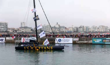 LES SABLES D'OLONNE, FRANCE - NOVEMBER 10, 2024: Clarisse Crmer boat (L'Occitane en Provence) in the channel for the start of the Vendee Globe 2024 on November 10,2024. in Les Sables d'Olonne, France. clipart