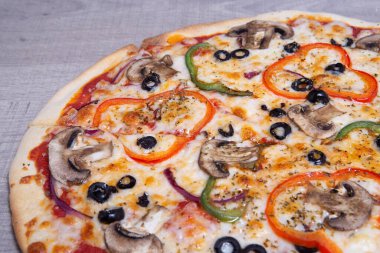 Veggie Pizza on wooden background, italian food