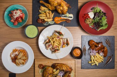 Variety of chicken dishes on a restaurant table