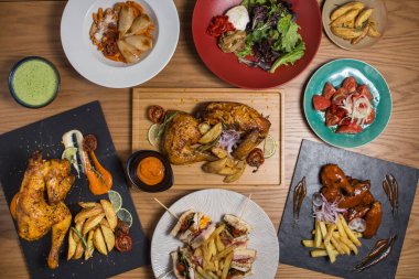 Variety of chicken dishes on a restaurant table