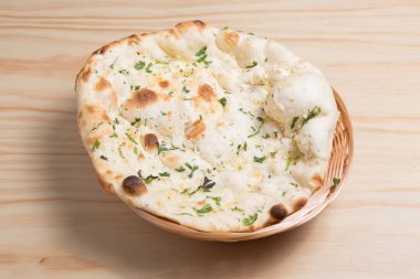 Fresh naan in plate for lunch tie, indian food