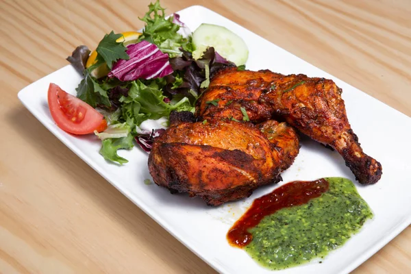 Tandoori chicken is a dish originating from Indian subcontinent. It is widely popular in South Asia, Middle Eastern and Western countries