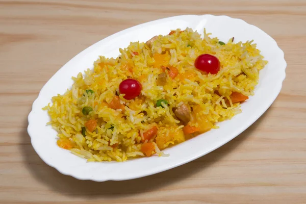A plate full of veg biryani or veg pulav or steamed rice or cooked rice for dinner