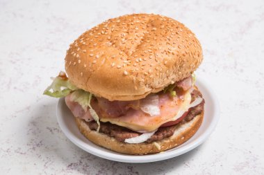 Fresh tasty burger on a plate in restaurant