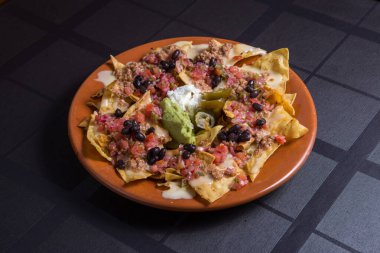 A plate of delicious tortilla nachos with cheese
