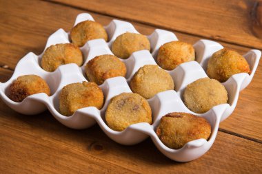 Delicious cheese croquettes on a white plate