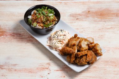 Fied chicken and salad on dish in thai menu