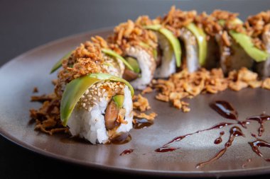 California roll served with aguacate on a plate