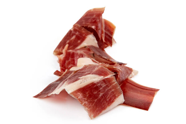 Cured meat ham jamon slice isolated on white
