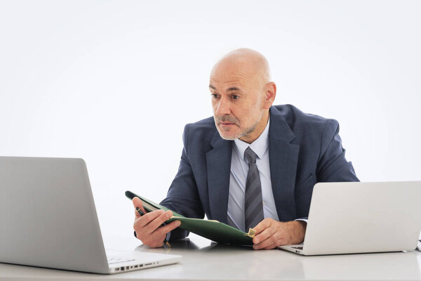 Middle Aged Man Sitting His Desk Looking His Laptop Amazement Royalty Free Stock Photos