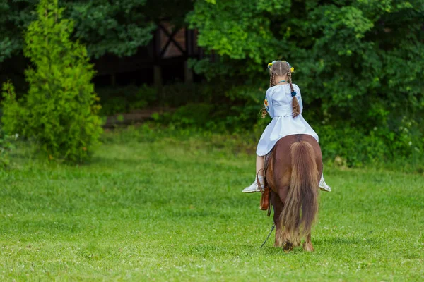 Little Girl Ukrainian National Costume Rides Pony Lawn — Stock Photo, Image