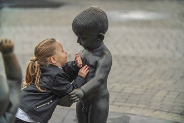 little girl playing in the square