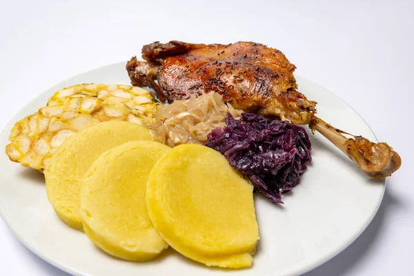 Roast duck, goose with dumplings and cabbage