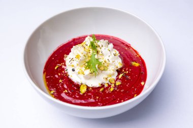 Roasted beetroot cream with lime espuma and pistachios
