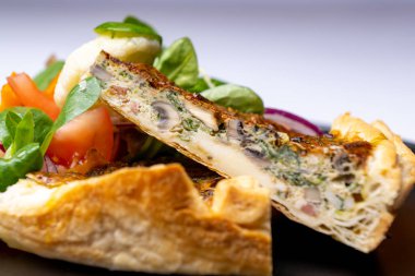 Spinach and mushroom quiche with fresh salad