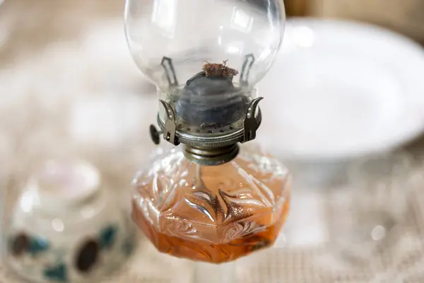 Old glass kerosene or paraffin lamp used in rural areas without electricity in the old days.