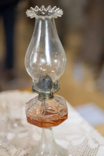 Old glass kerosene or paraffin lamp used in rural areas without electricity in the old days.