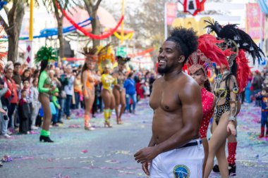 LOULE, PORTUGAL - 17th FEB 2024: Colorful Carnival (Carnaval) Parade festival participants on Loule city, Portugal. clipart