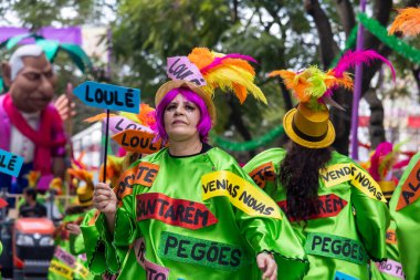 LOULE, PORTUGAL - 17th FEB 2024: Colorful Carnival (Carnaval) Parade festival participants on Loule city, Portugal. clipart