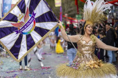 LOULE, PORTUGAL - 17th FEB 2024: Colorful Carnival (Carnaval) Parade festival participants on Loule city, Portugal. clipart