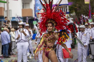 LOULE, PORTUGAL - 17th FEB 2024: Colorful Carnival (Carnaval) Parade festival participants on Loule city, Portugal. clipart