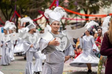 LOULE, PORTUGAL - 17th FEB 2024: Colorful Carnival (Carnaval) Parade festival participants on Loule city, Portugal. clipart