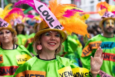 LOULE, PORTUGAL - 17th FEB 2024: Colorful Carnival (Carnaval) Parade festival participants on Loule city, Portugal. clipart