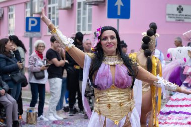 LOULE, PORTUGAL - 17th FEB 2024: Colorful Carnival (Carnaval) Parade festival participants on Loule city, Portugal. clipart