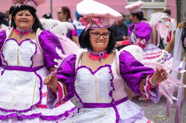 LOULE, PORTUGAL - 17th FEB 2024: Colorful Carnival (Carnaval) Parade festival participants on Loule city, Portugal. clipart